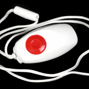 Hand holding a Safesound Personal Alarm system